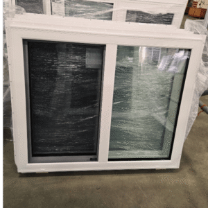 A 47 inch x 39 inch single slider window with a white vinyl frame