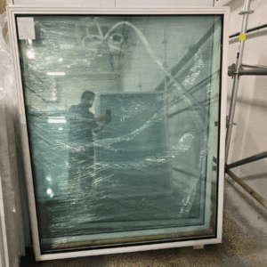 A 59" x 70" fixed window with a white virgin vinyl frame