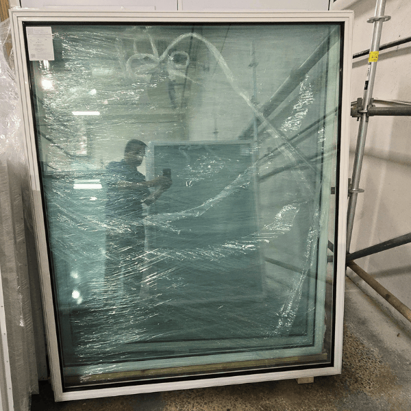 A 59" x 70" fixed window with a white virgin vinyl frame