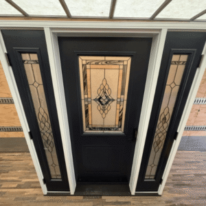 A Half Light Craftsman Style Door in black with decorative glass and dual side lights