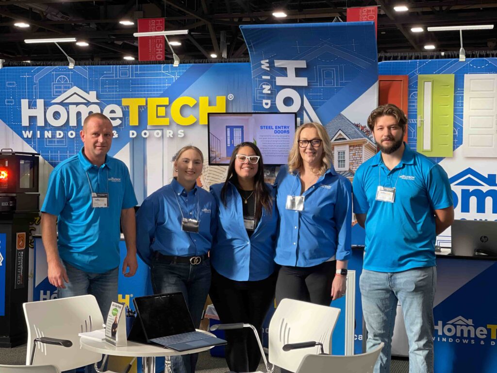 HomeTECH Windows & Doors team members at a Home Show booth showcasing window and door solutions in Alberta
