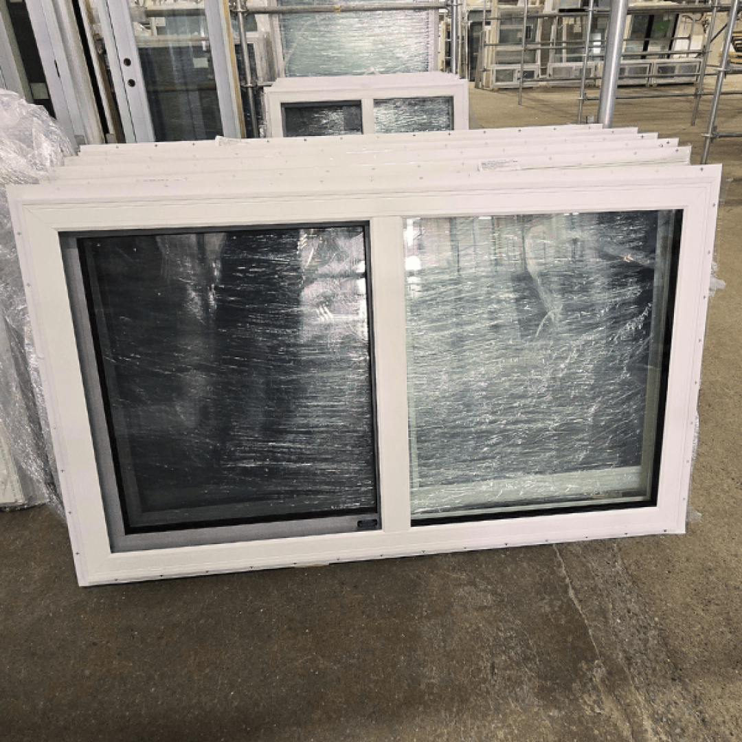 A 59 inch x 35 inch single hung window with a white vinyl frame