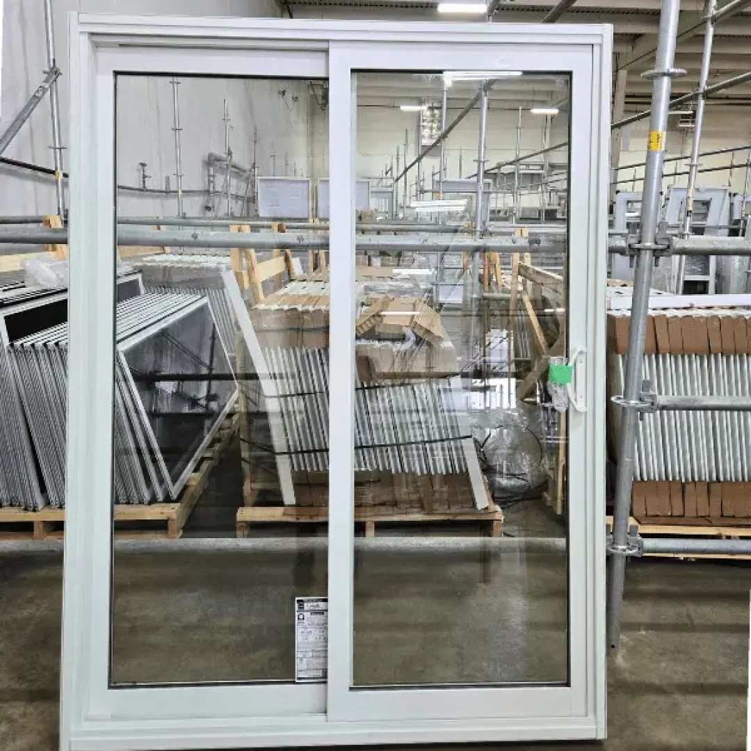 A Patio door with a white vinyl frame